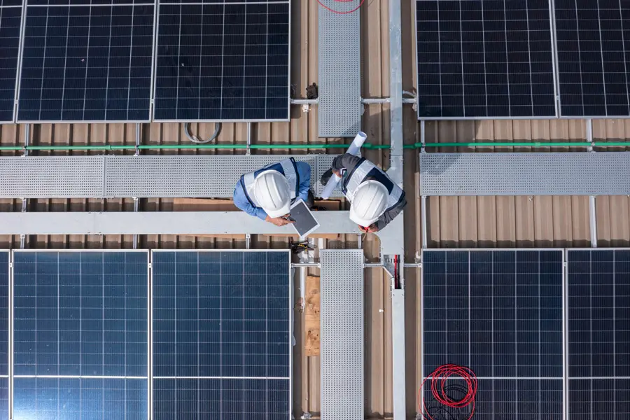 Drone view of technician installing solar panels 2023 12 01 02 55 59 utc